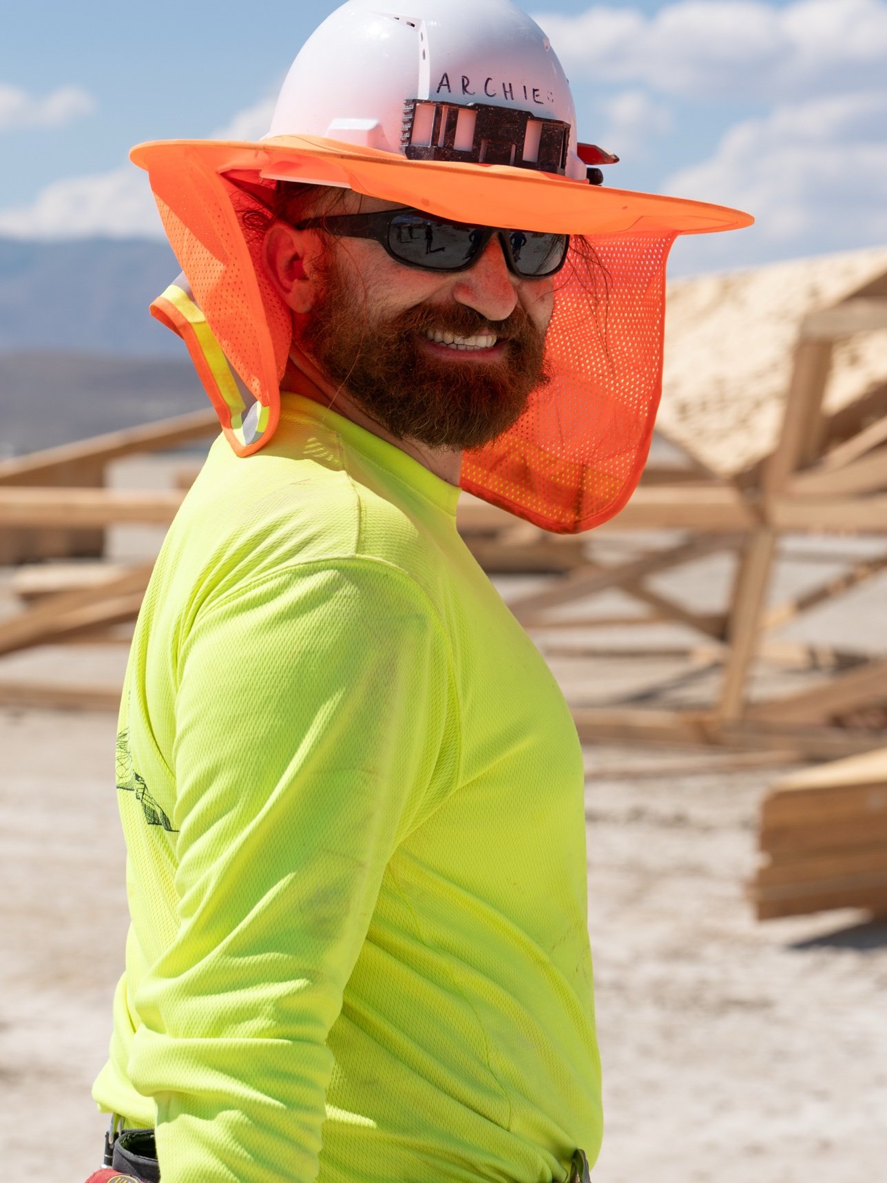 Archie Japaridze in a hard hat on a build site in the desert