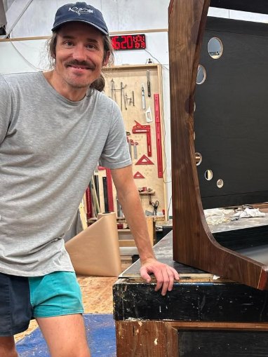 Dustin Stern in the shop, wearing shorts