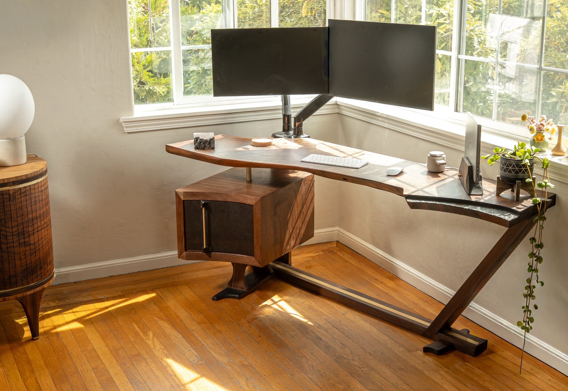The Lani Leads desk in a corner, with its floating cabinet and cantilever legs