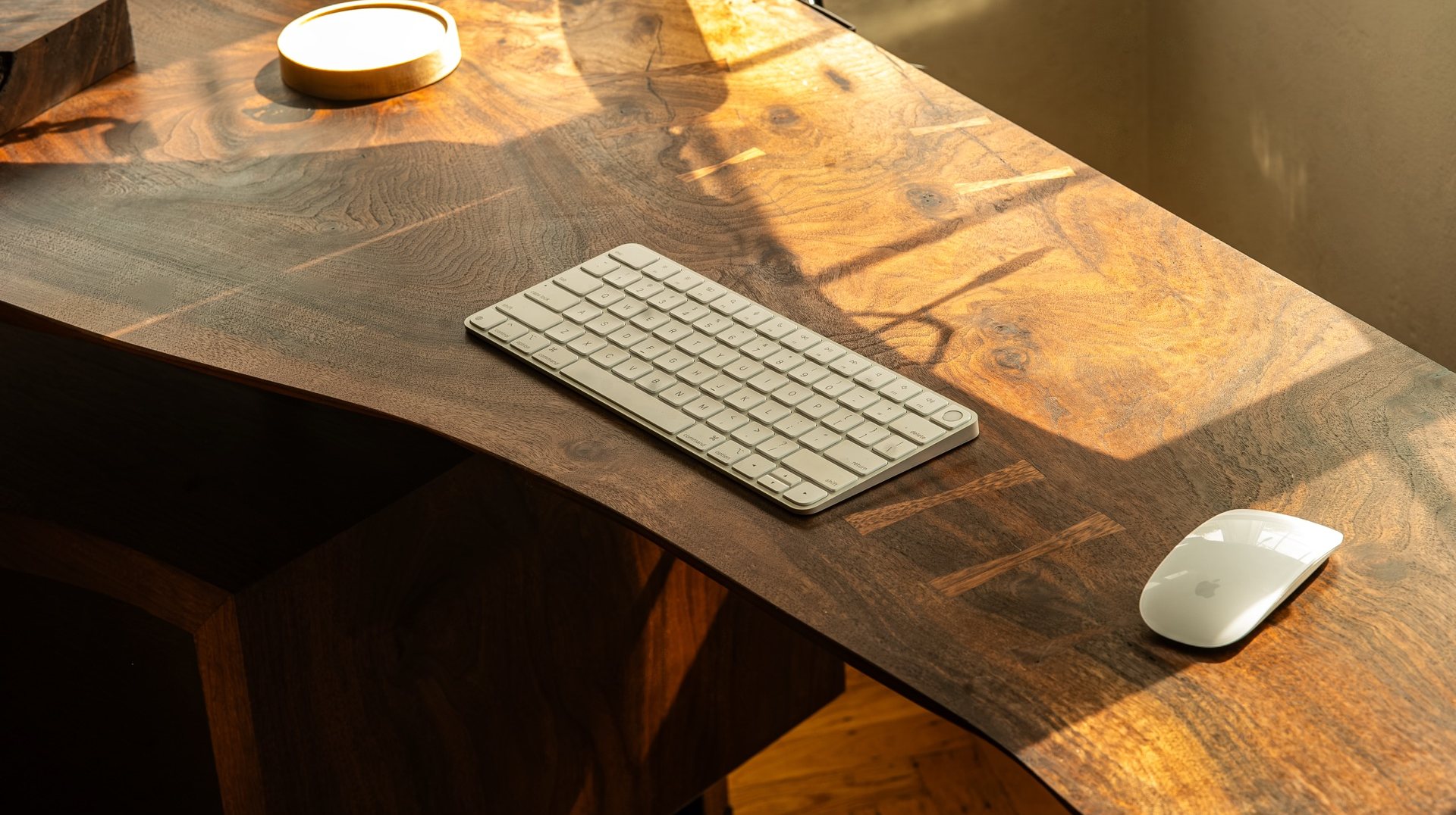 The claro walnut slab top of the Lani Leads desk